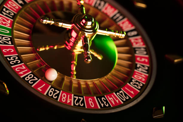 istock Casino roulette wheel. Green and red contrast light. 812983748