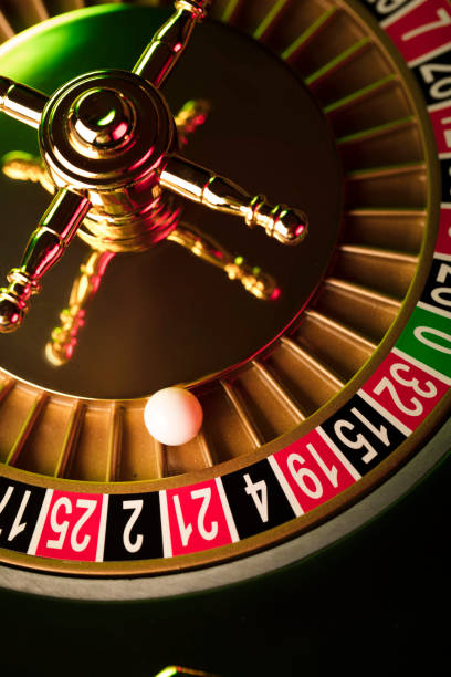 istock Casino roulette wheel. Green and red contrast light. 812983980