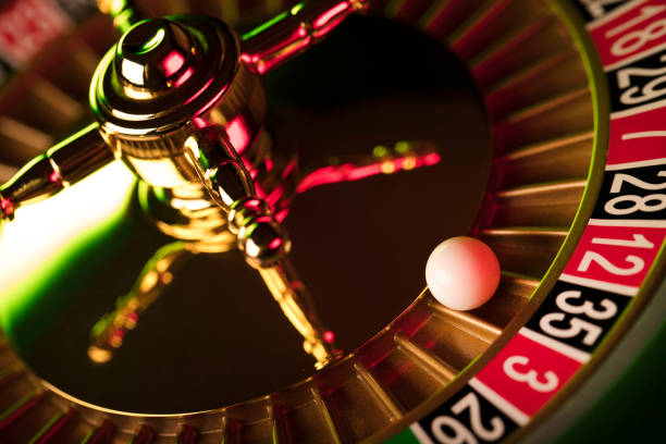 istock Casino roulette wheel. Green and red contrast light. 812984068