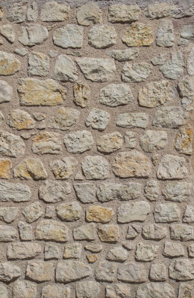 istock Wall made of the same type of stones 812984100