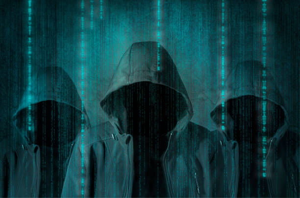 Hacker Group of hackers at work with graphic user interface around Conspiracy stock pictures, royalty-free photos & images