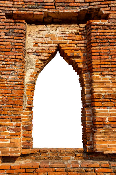 istock Ancient Brick Window Frame of an Ancient Thai Temple Over White 812990046