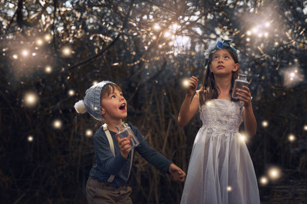 catching some magical creatures - happy kid flash imagens e fotografias de stock