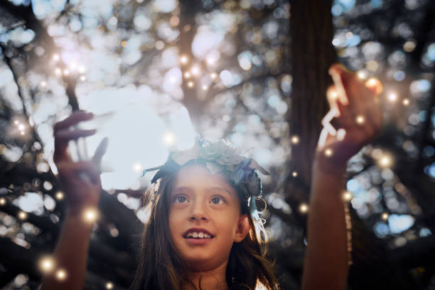 They're so real yet so magical Shot of a little girl catching fireflies in a jar outside firefly forest stock pictures, royalty-free photos & images