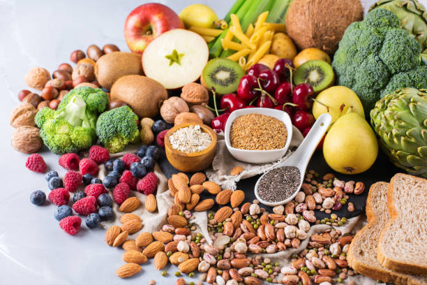 Selection of healthy rich fiber sources vegan food for cooking Healthy balanced dieting concept. Selection of rich fiber sources vegan food. Vegetables fruit seeds beans ingredients for cooking. Copy space background healthy snacking stock pictures, royalty-free photos & images