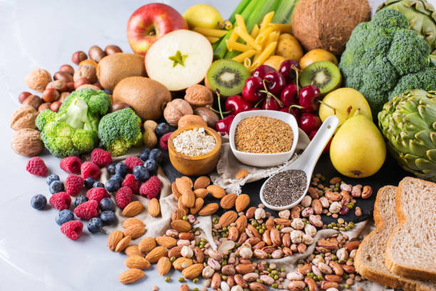 Selection of healthy rich fiber sources vegan food for cooking Healthy balanced dieting concept. Selection of rich fiber sources vegan food. Vegetables fruit seeds beans ingredients for cooking. Copy space background saturated fat stock pictures, royalty-free photos & images