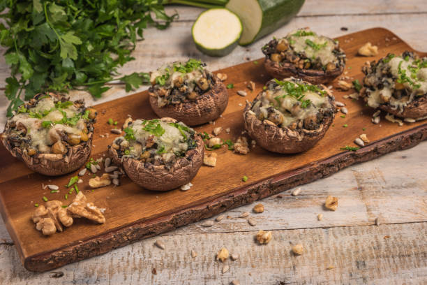 istock Mushroom caps stuffed with vegetables and cheese 813001756