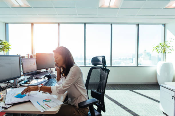 istock Businesswoman working at her desk in office. 813001906