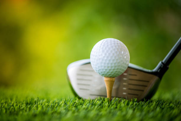 istock teeing off with golf club and golf ball 813012122