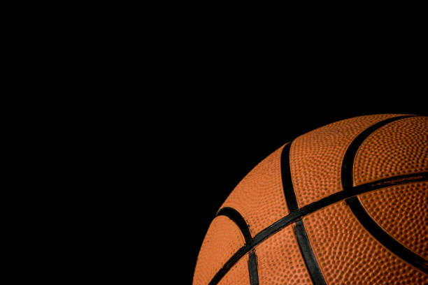 istock A single basketball isolated on a black background 813015248