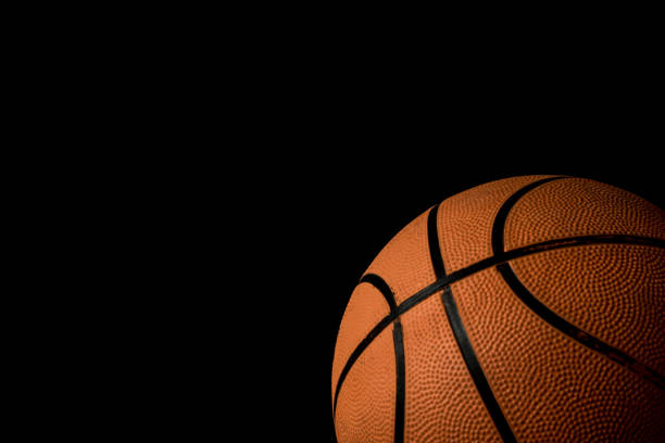 istock A single basketball isolated on a black background 813015780