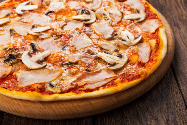istock Delicious pizza with mushrooms and smoked chicken 813024390