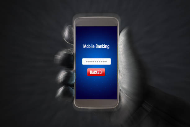 istock Mobile banking hack and cyber security concept. Hacker and criminal login to persons online bank application and steal money from account with smartphone. Thief with black leather gloves. 813024666
