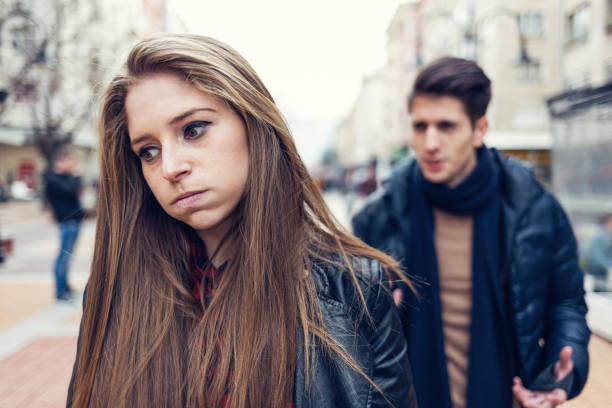 istock Young couple on the street arguing 813038368
