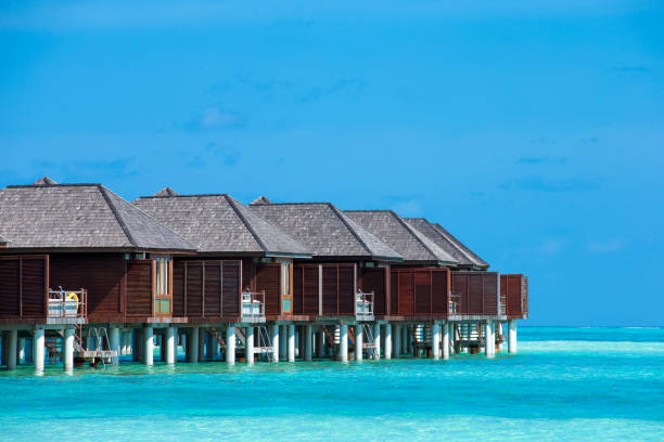 beach with water bungalows at Maldives