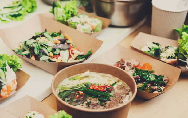 Street vendor's salads, closeup of snacks in craft package