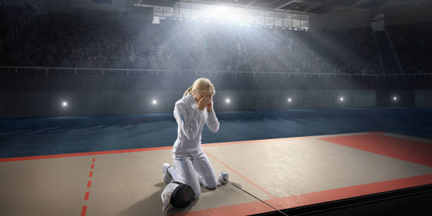 istock Sad fencer on the big professional stage 813058444