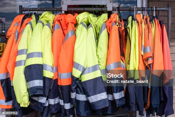 Protective Clothing On Rack Stock Photo - Download Image Now - Protective Workwear, Working, Reflective Clothing