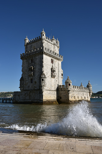 Lisbon, Portugal - June 11, 2017: Belem Tower or Torre de Belem on the bank of Tagus River at sunset. Lisbon, Portugal. UNESCO World Heritage Site. Monument of Portuguese maritime discoveries of the era of Age of Discoveries