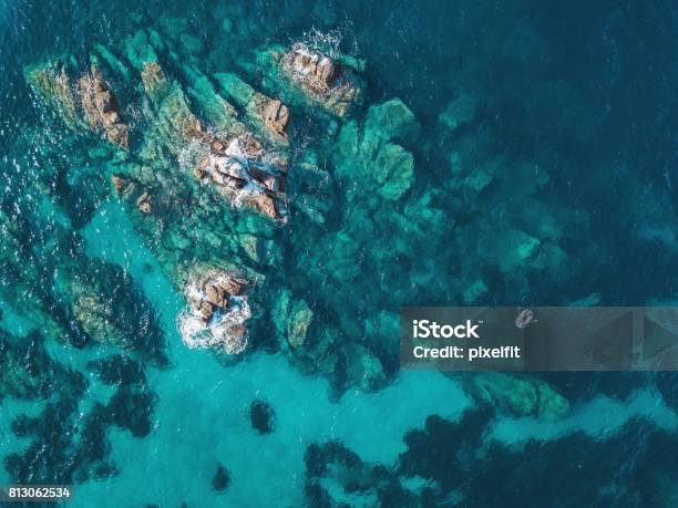Lonely Boat Near Reefs Stock Photo - Download Image Now - Sea, Aerial View, Water