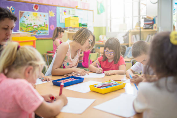 istock School kids drawing in the classroom 813064994