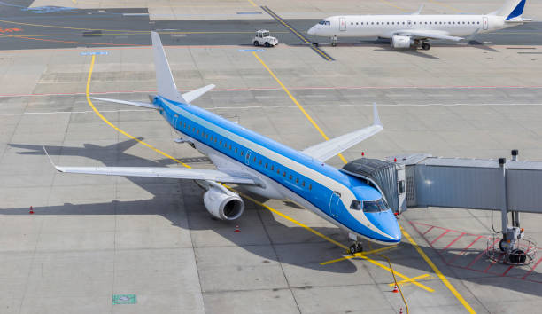 istock Airport with airplane standing on airfield waiting 813065260