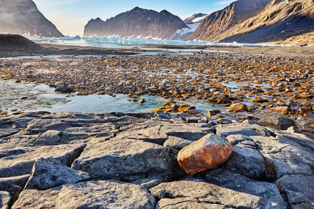Sunset over the Okshornan mountain range at Tungeneset on the island of Senja in Northern Norway at the end of a beautiful day in winter.