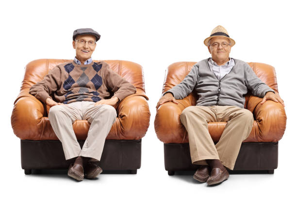 istock Two elderly men sitting in leather armchairs 813068156