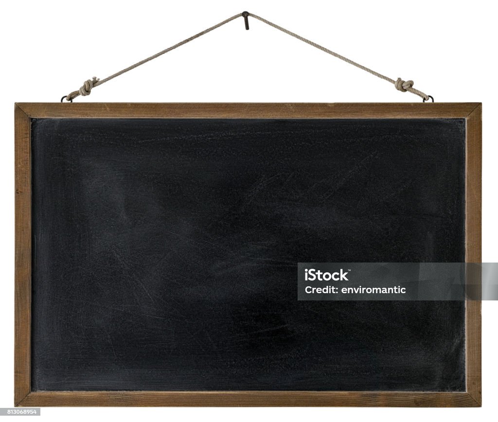 An old wooden framed blackboard hangs from a rusty nail, isolated on white, clipping path included. An old wooden framed blackboard hangs from a rusty nail, isolated on white, clipping path included. Good copy space with lots of rustic character. Chalkboard - Visual Aid Stock Photo