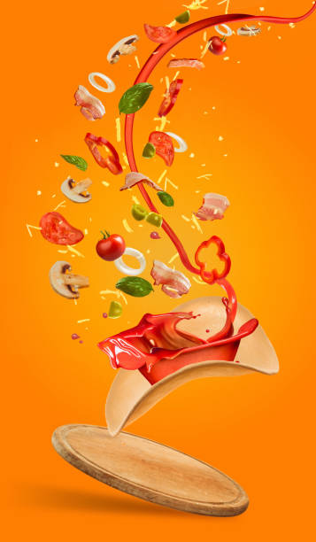 istock Tasty pizza and falling ingredients on orange background 813069158