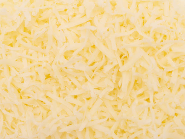 grated cheese grated cheese background shredded mozzarella stock pictures, royalty-free photos & images