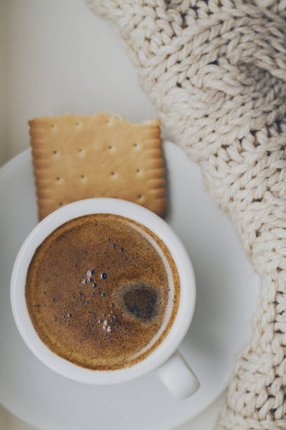 istock Tasty coffee espresso in small cup on grey plaid. Home concept. Top View. Toning. 813078700