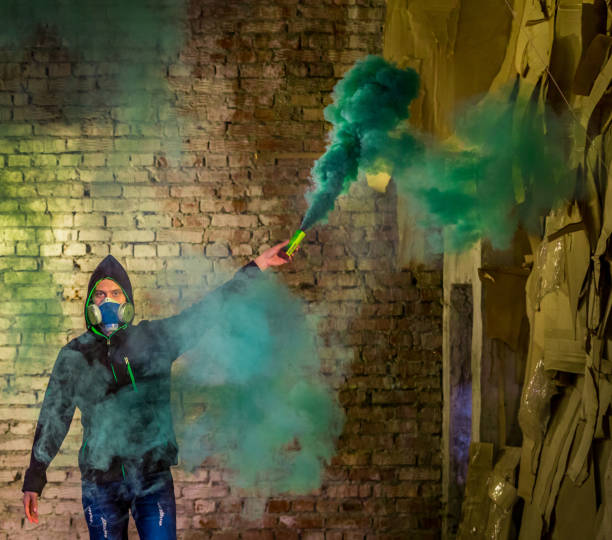 istock Young Man Rebel With Smoke Grenade In Hand 813081500