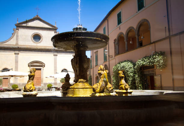 istock Tuscania (Lazio), Italy: Main Piazza with Fountain and Church 813089590