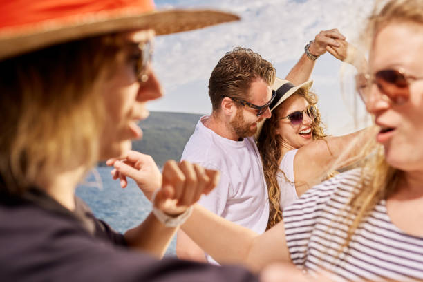 istock Group of people dancing at the beach party 813099590