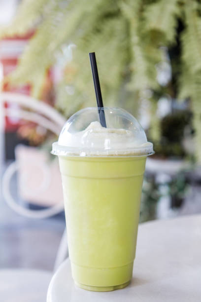 istock Green tea matcha smoothies in a plastic cup. 813121820
