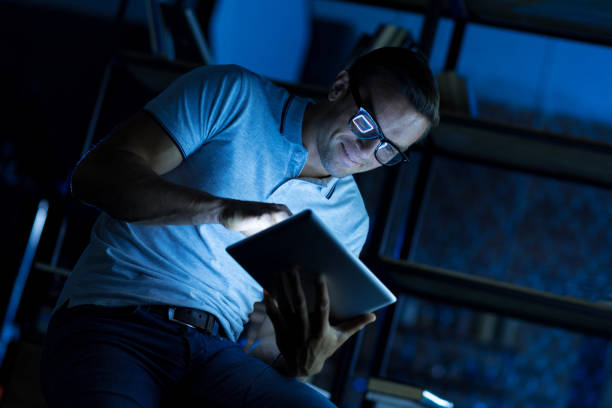 istock Enthusiastic clever guy staying late in office 813129034