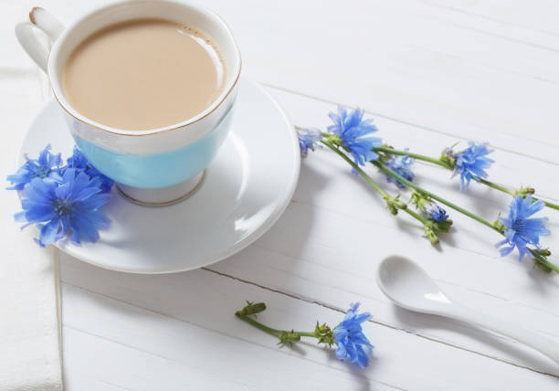 istock Drink from chicory in a cup on the white wooden table 813132248