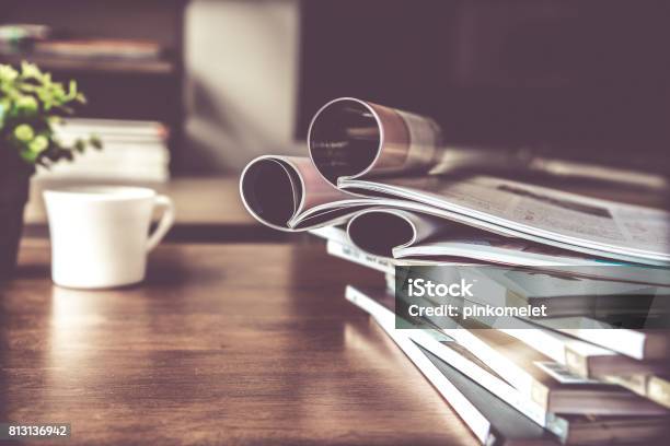 Selective Focus Of Stacking Magazine Place On Table In Living Room Stock Photo - Download Image Now