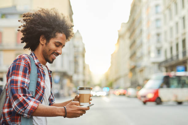 Young trendy man in Barcelona. Young trendy man in Barcelona. Business on the go, technology, millennials lifestyle. black taxi stock pictures, royalty-free photos & images