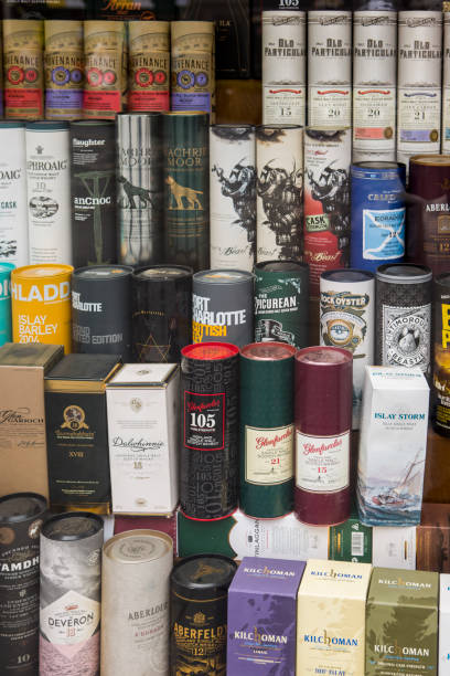 Famous traditional alcoholic whiskey drink bottle brands store window display at edinburgh Scotland England UK