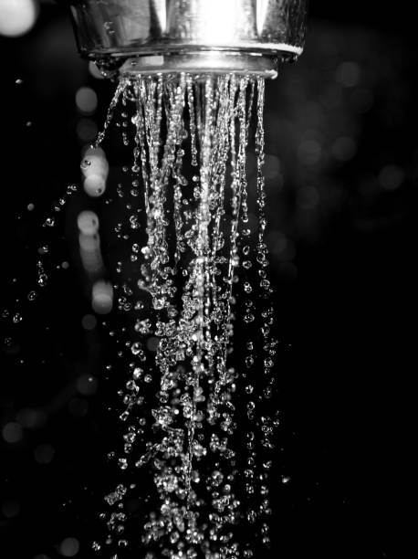 istock Shower with water isolated on a black background 813145452