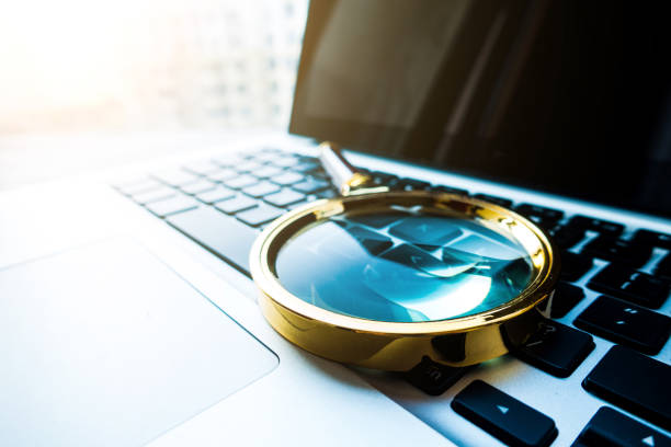 istock Magnifying Glass On Laptop 813155524