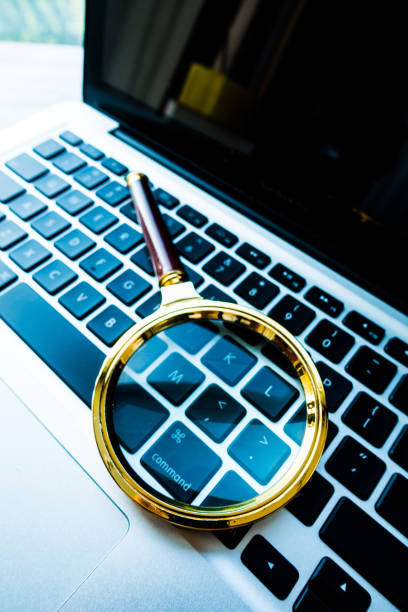 istock Magnifying Glass On Laptop 813155570