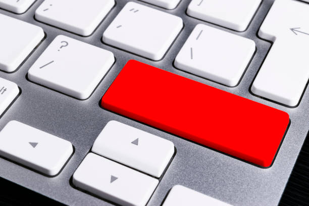 istock Close up view of a Computer notebook keyboard with one red key, technology background, empty space for text 813155700