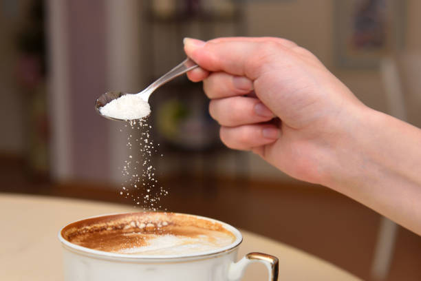 istock The girl's hand pours sugar 813160874
