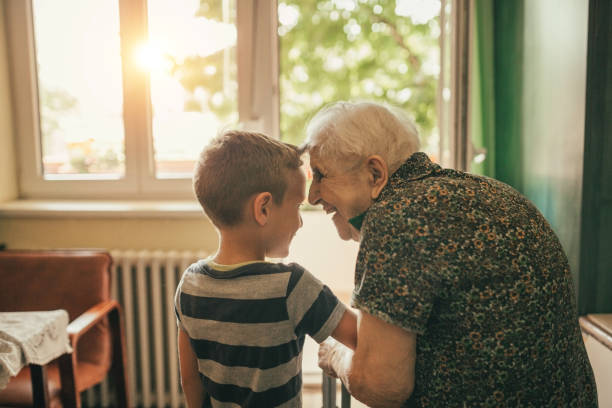 grandson visiting his granny in nursery - great grandmother imagens e fotografias de stock