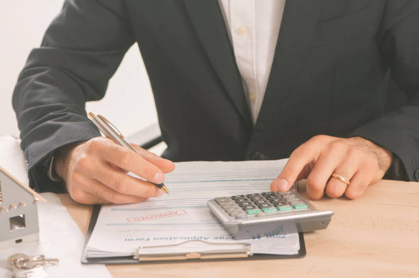 istock Businessman signing a mortgage  contract 813187062