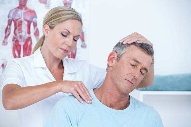 istock Doctor examining her patient neck 813187984
