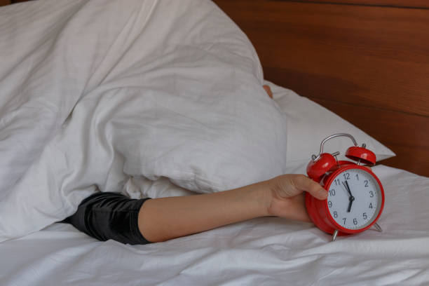 istock Beautiful girl covered her pillow over her head 813192562